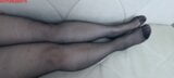 From another point of view, Anna's black pantyhose, legs and feet. snapshot 2