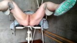 Gyno speculum in her pussy on gyno chair snapshot 2