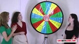 3 meninas muito bonitas jogam uma partida de strip spin the wheel snapshot 2