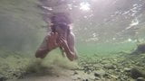 Boy swiming naked in the water snapshot 3