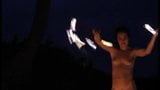 nude woman playing with fire snapshot 3