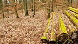 Slapping her naked vagina on a woodpile snapshot 1