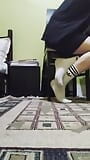 Cute twink showing his dirty white socks, while he listening to music and singing. snapshot 4