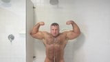 bodybuilder andre mark flexing in shower snapshot 3