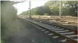 Public stroking by train tracks snapshot 1