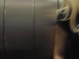 Blonde pees in lift snapshot 2