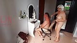 Nudist barbershop. Nude lady hairdresser in an apron makes client to strip. The client is surprised. 3 snapshot 2