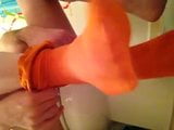 Putting on some orange tights and playing with my cock snapshot 2