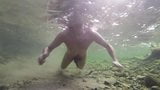 Boy swiming naked in the water snapshot 8