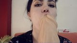 StacyMoon is sucking and licking a giant dildo snapshot 5