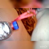 Slave lifts a water bottle with her pussy lips snapshot 4