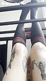 Caged Slave Girl in knee High Socks Rubs Feet Against Bars snapshot 2