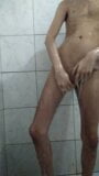 Young skinny taking a shower snapshot 3