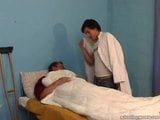 Cute Daddy with young buy in hospital bed snapshot 2