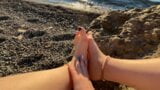 Mistress Lara plays with her feet and toes on the beach snapshot 16