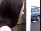 Girl pissing in a parking lot snapshot 2