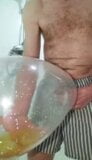 Pissing in an inflated condom snapshot 4