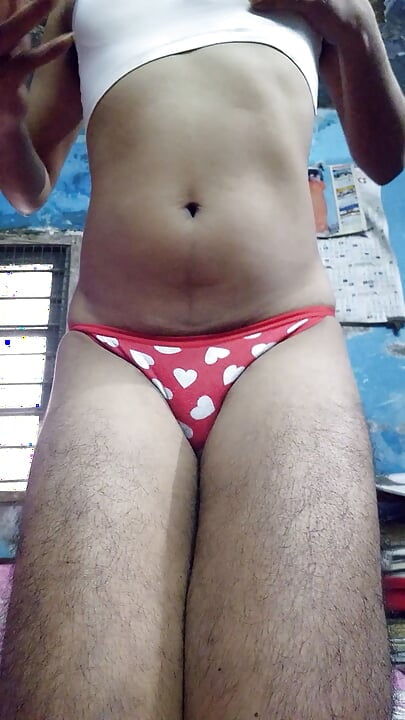 Indian teen boy wearing sports bra and red heart panty