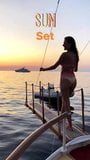 Alessandra Ambrosio jumping into the water at sunset snapshot 1