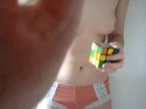 Topless Amateur solves rubiks cube in just over 1 minute snapshot 1