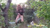 Redheaded Babe Pisses Long And Hard In Trees snapshot 6