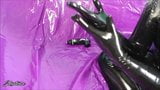 Putting on shiny black latex rubber gloves snapshot 7