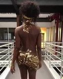 African Girl Wearing Gold Walks snapshot 3