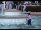 Marjorie is getting wet in a public fountain - outdoor snapshot 3