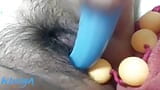 Watch how my hairy pussy eats some pingpong balls and a long and delicious big dildo blue snapshot 1