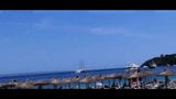 Beach sun bathing couple snapshot 1