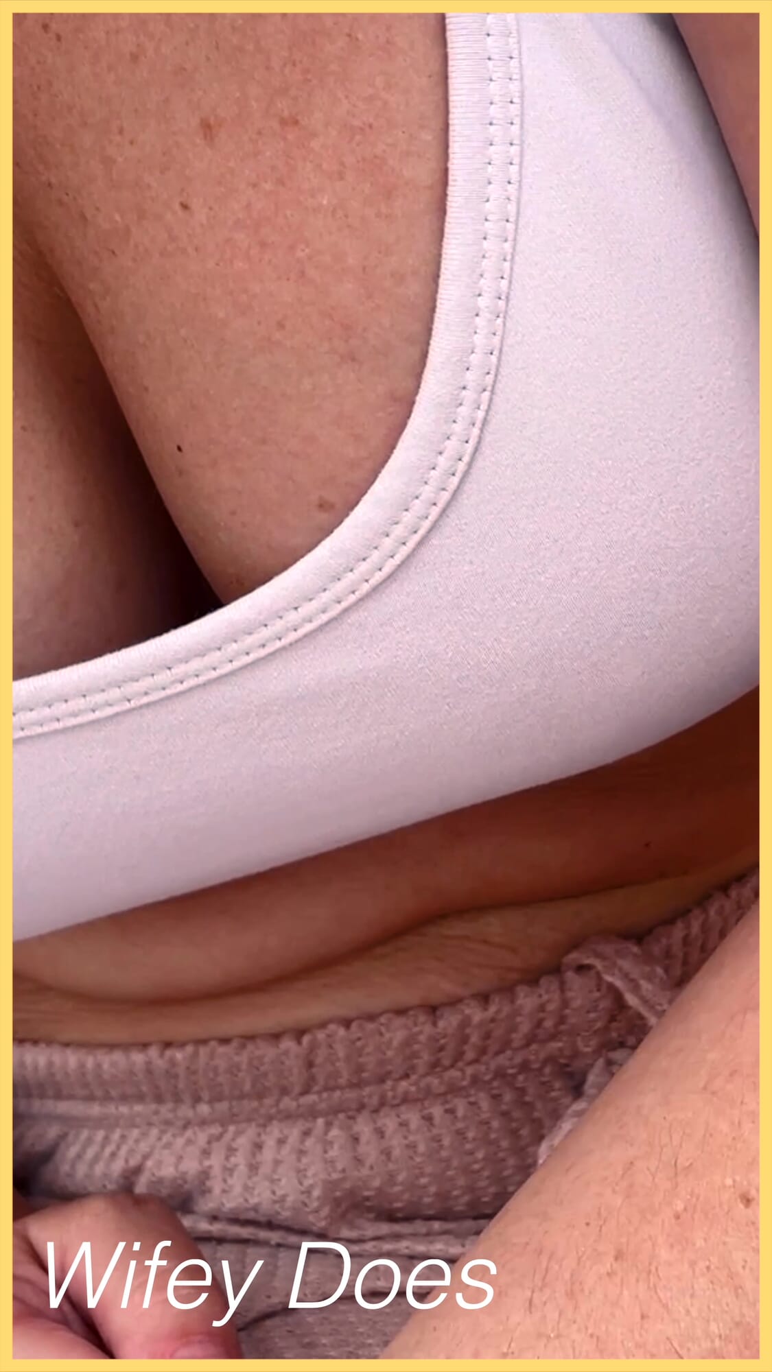 Wifey shows perfect cleavage in this tight white sports bra check out this hot MILF amazing cleavage snapshot 3