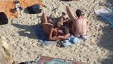 Group of guys having sex on the beach snapshot 8