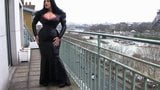 Busty lady in black latex gives a blowjob snapshot 3