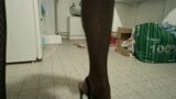 me in black high heels and black fishnet pantyhose and red polish toesnails snapshot 3