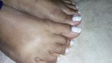  Closeup on Morenafeet's fingers with French nail polish snapshot 1