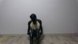 Latex dog crossdresser wearing latex catsuit and swimsuit snapshot 3