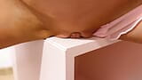 Beauty in pink panties humps pussy against the table corner. snapshot 14