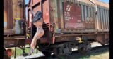 Dancing naked Outdoor among old trains snapshot 2