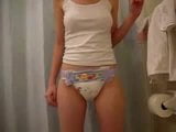 girl in bathroom in her nappy snapshot 5