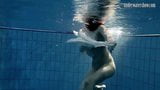 Dark haired teen Andrea in the pool snapshot 2