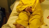 Filling up a condom in a yellow raincoat snapshot 5