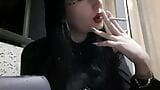 Dominatrix Nika smokes a cigarette on the balcony. Mistress sexy red lips blow smoke in your face snapshot 2