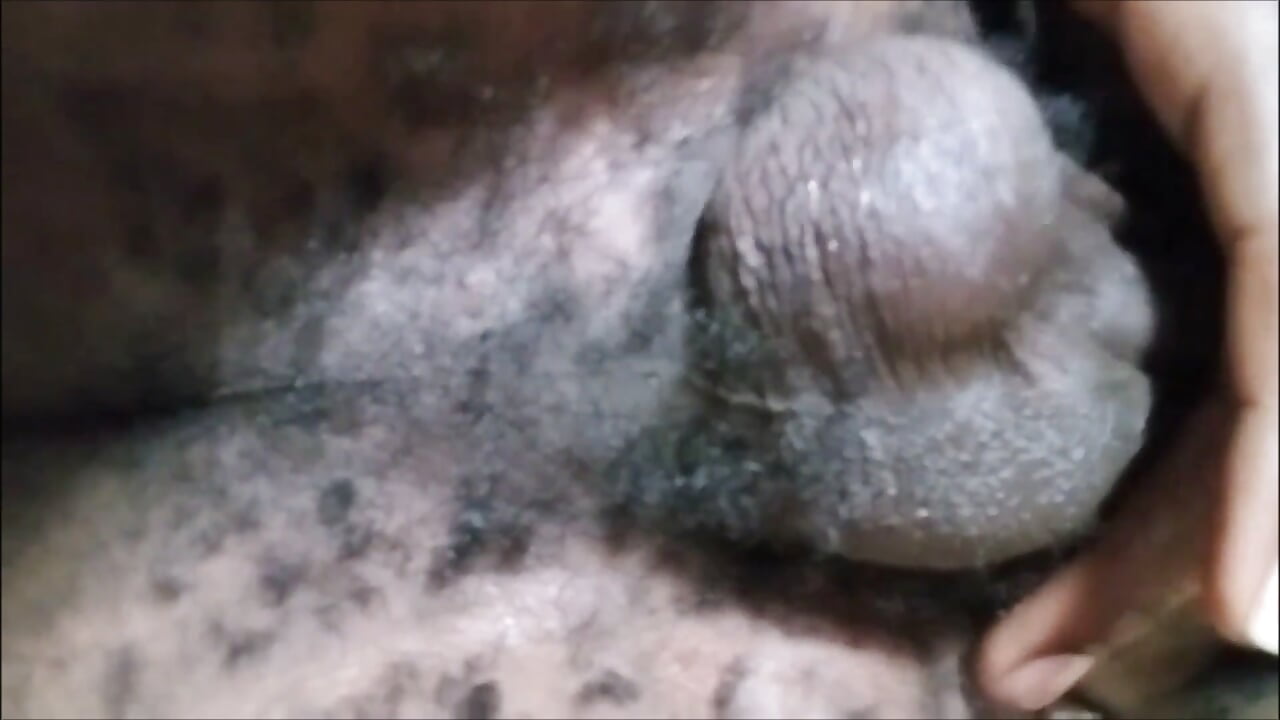 Horny black amateur Kenyan massaging his dick on the sofa