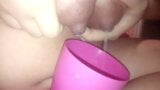 Young mom pours milk from boobs into a cup snapshot 11