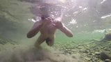 Boy swiming naked in the water snapshot 7