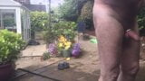 Naked gardening. Watering, muddy play and cold shower snapshot 7