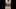 Aziatische mietjesslet die een grote pik berijdt terwijl ze een keelneukknevel draagt