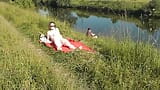 Nudist beach. Public nudity. Sexy MILF without panties and bra sunbathes naked is not shy about fisherman. Naked in public. Milf snapshot 18