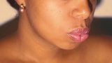 Sexy lips ebony playing with her red lipstick in close up snapshot 5