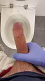 Jerking doctor at a toilet with latex gloves snapshot 1